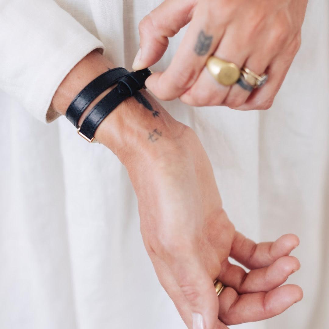 woman wearing black double leather strap kimsey watch