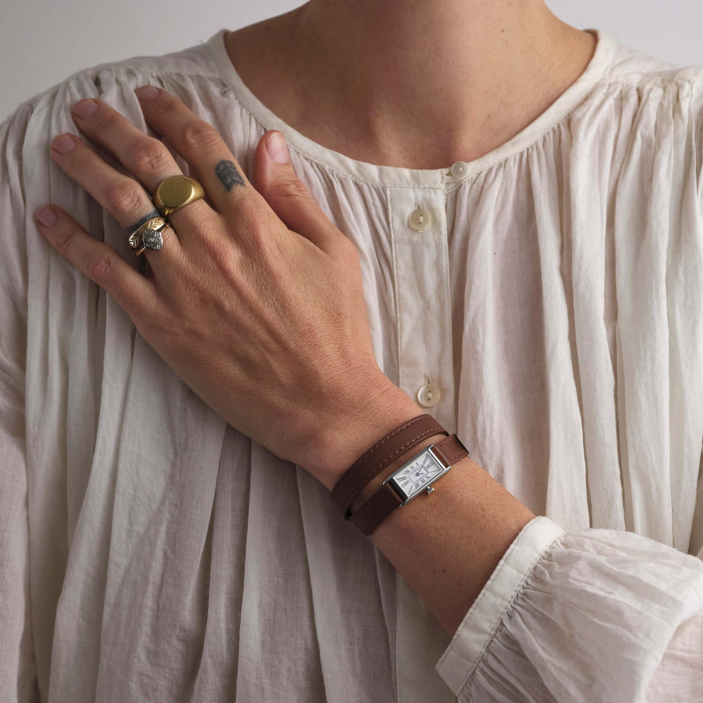 Woman wearing white shirt and Kimsey Watch in Brown Leather “Double Wrap” Strap and silver hardware